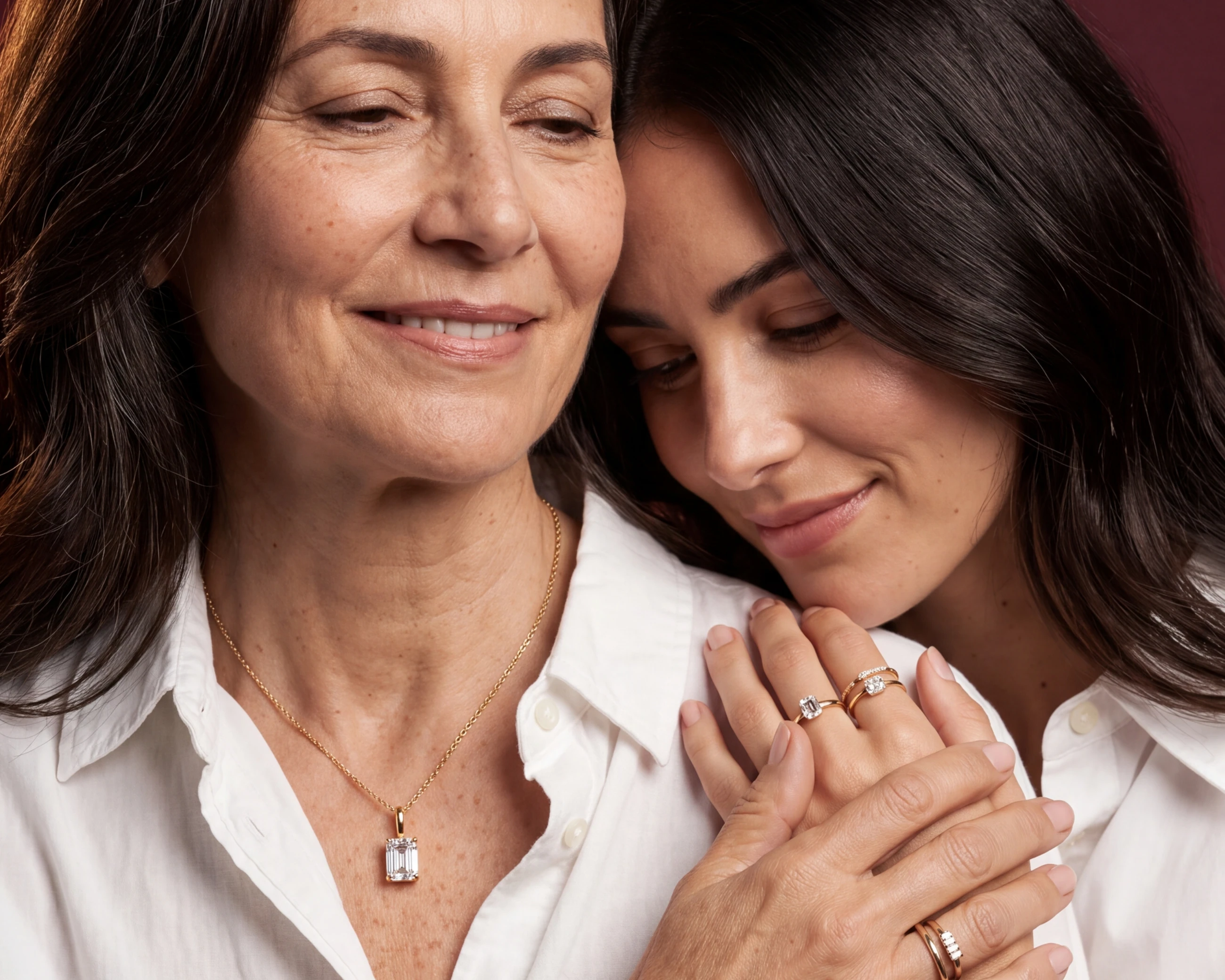 Two generations share a quiet portrait with heirloom jewellery.